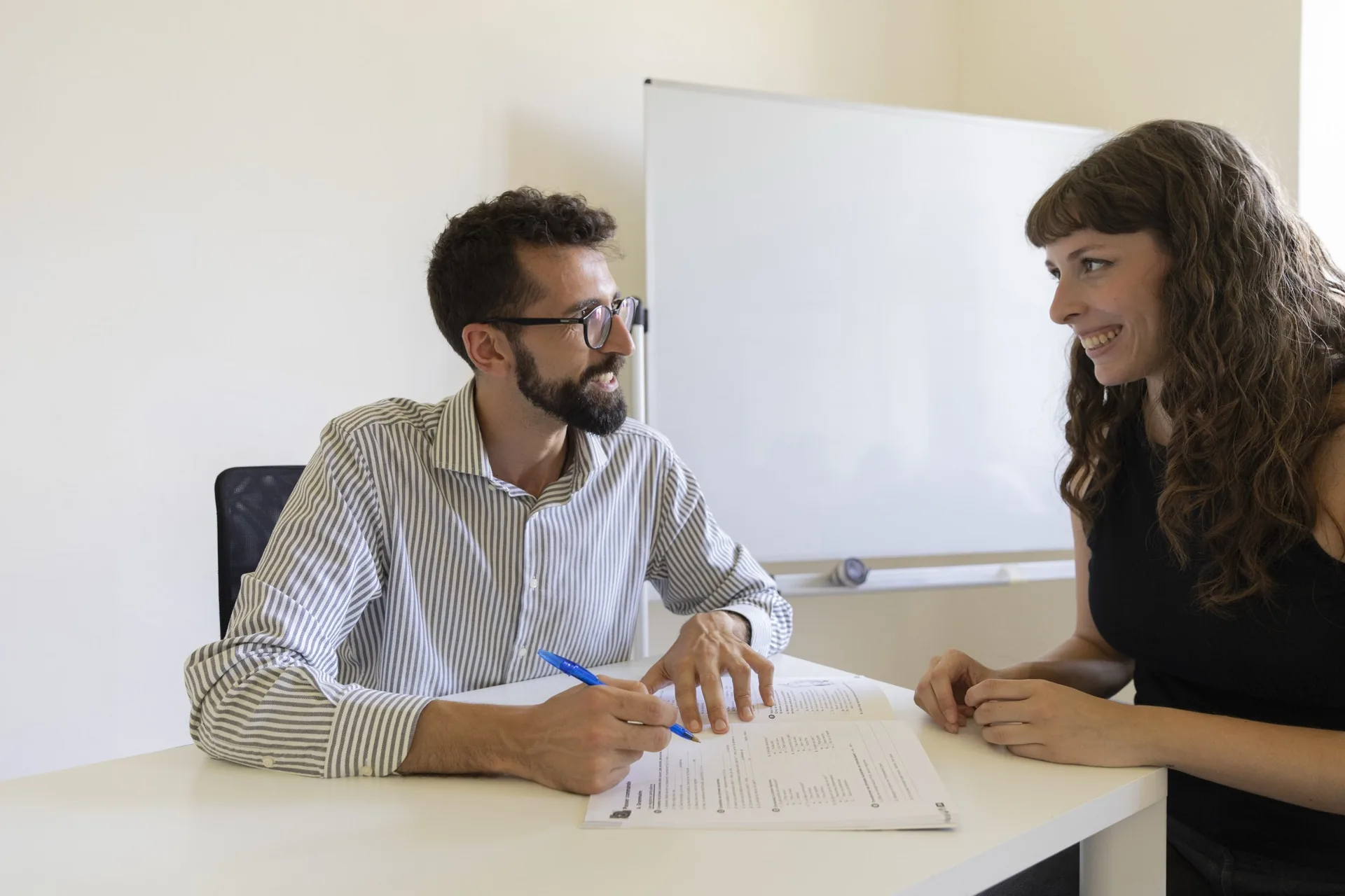 Tutor reviewing documents with a student
